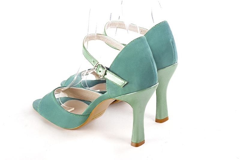 Mint green women's closed back sandals, with an instep strap. Round toe. Very high spool heels. Rear view - Florence KOOIJMAN
